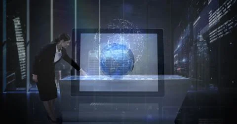 Interacting executive in suit operating touchscreen table at high-tech office, Foto stock