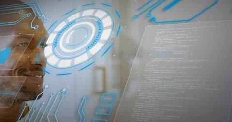 Interacting man in dark top studying holographic blue-ring HUD and code panel in Stock Photos