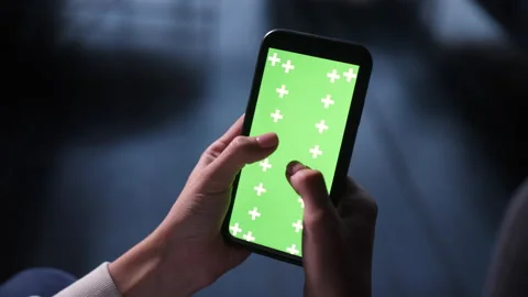 Interacting with mobile phone green screen for advertising space on surface. Stock Footage 166542741