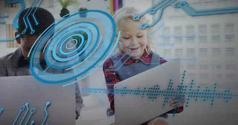 Interacting students in collared and red plaid using laptop and tablet with blue Stock Photos