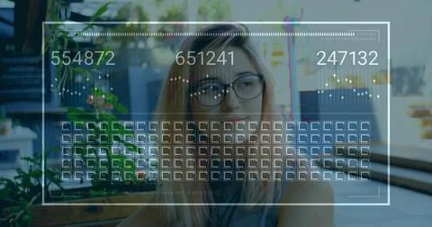 Interacting tech professional analyzing data interface at desk in coworking Stock Photos