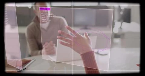 Interacting woman's ringed hand in maroon sleeve gesturing over AR panel in Stock Photos