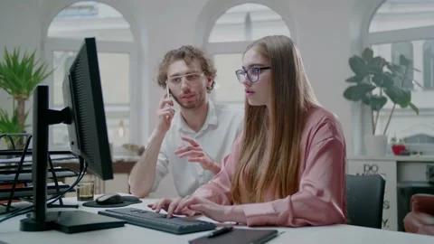 Interactive Adults Programming on Desk While Man Make Phone Call. Work at Home. Stockbeeldmateriaal 131018132