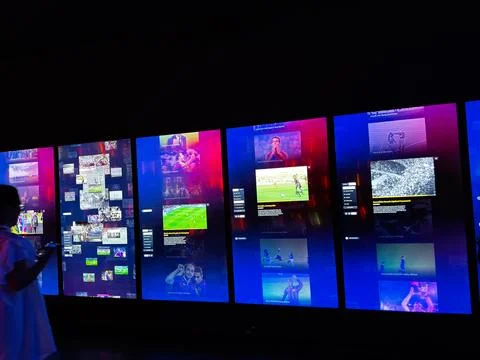 Interactive digital display wall showing football highlights and multimedia.. Stock Photos