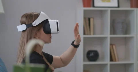 Interactive educational program with using HMD-display, woman is wearing VR 動画素材 147262164