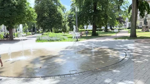 Interactive Fountain in Hebel Park with Passing Pedestrians Video stock 341438359
