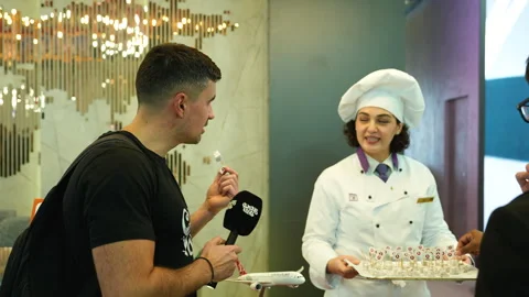 Interactive Interview with Turkish Chef at Culinary Exhibition Stock Footage 324700063