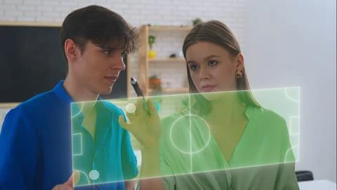 Interactive Learning: Students Engaging with Digital Infographics Stock Photos