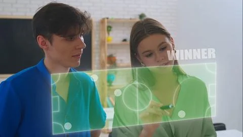 Interactive Learning: Students Engaging with Digital Infographics Stock Photos