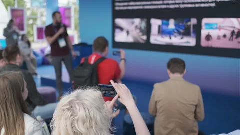 Interactive presentation at a technology event with audience capturing moments Stock Footage 312798442