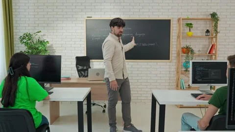 Interactive Programming Lesson with Attentive Student and Instructor Stock Footage 281071459