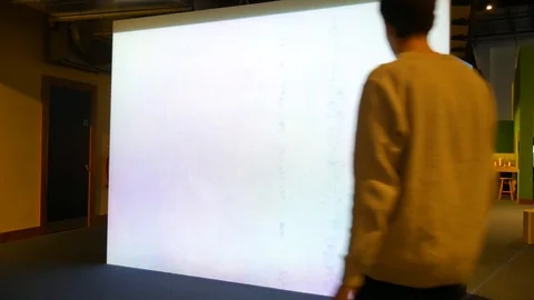 Interactive Water Wall being used by two Caucasian Men at the W5 technology Video stock 89813854
