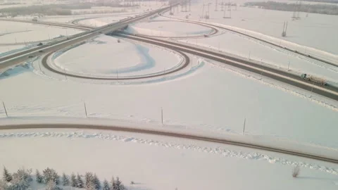 Interchange with a road bridge in winter, aerial view. Highway panorama on a Stock Footage 194534459