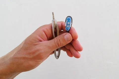 Interchangeable attachments for toothbrushes in hand. Stock Photos