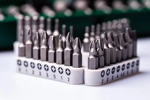 Interchangeable screwdriver bit set, isolated on white, selective focus,  dof Stock Photos