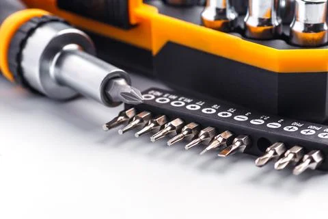 Interchangeable screwdriver set with different types of metal steel heads and Stock Photos