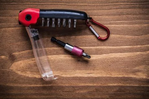 Interchangeable turnscrew bits in toolbox on wood board construction concept Foto stock