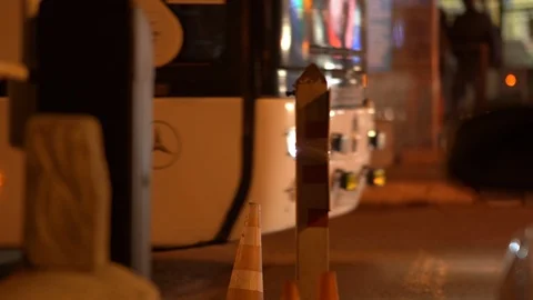 Intercity bus coach station automatic boom barrier gate at night Stock Footage 124220903