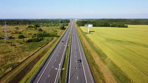 Intercity highway in summer, drone view of an intercity road between fields Stock Footage 201067425