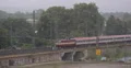 Intercity Train Arrival Germany Countryside Scene Bridge Crossing Commuters Day 4k or 4k+ Resolution