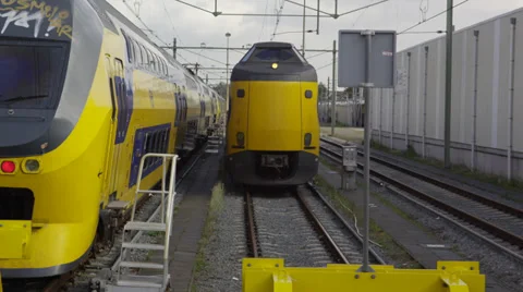 Intercity train is parked next to another train on a side track Stock Footage 39651250