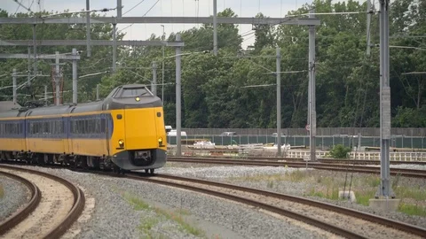 Intercity train with passengers passing Video stock 110017902