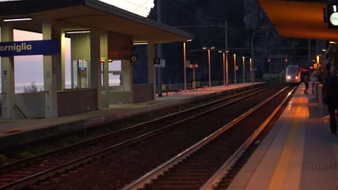 Intercity train transiting Corniglia Train Station in Cinque terre Stock Footage 158512519