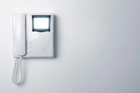 An intercom doorbell and access code panel on the wall Stock Photos