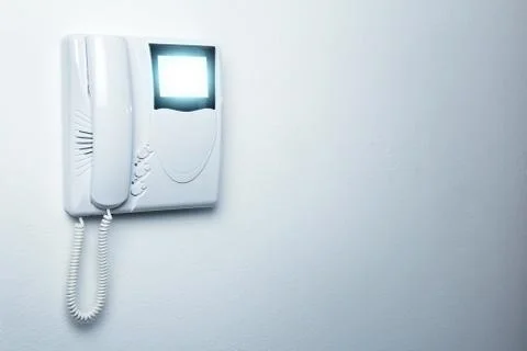 An intercom doorbell and access code panel on the wall Stock Photos