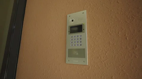 Intercom installed near entrance provides secure access Stock Footage 329706769