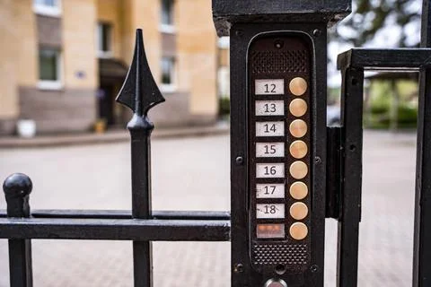 Intercom panel with a video camera on the brick fence of private house Foto stock