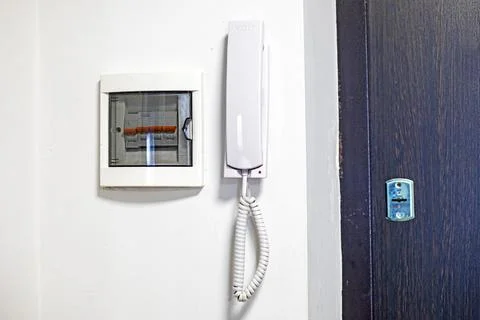 Intercom with a panel for voltage regulation in the hallway Stock Photos