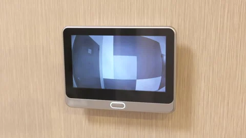 Intercom screen of door peephole surveillance camera on entrance door Stock Footage 262341940
