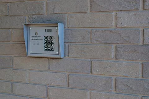 Intercom system on brick wall residential entrance Stock Photos