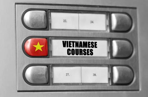 On the intercom there is a button with the flag of Vietnam and the inscript.. Stock Photos