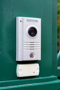 An intercom with a video camera and a microphone for voice. Stock Photos