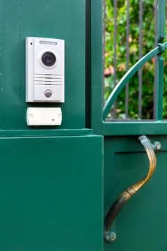 An intercom with a video camera and a microphone for voice. Stock Photos