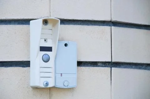 Intercom on the wall of the house. Close-up. Stock Photos