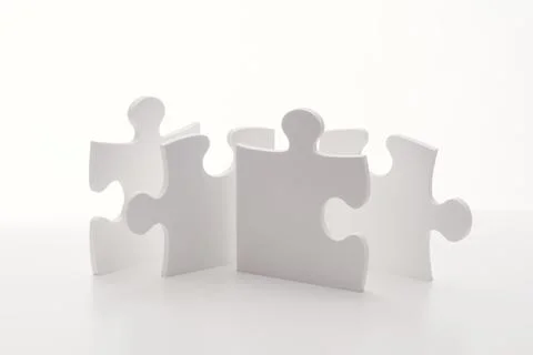 Interconnected Puzzle Pieces in Circle Representing Teamwork and Collaboratio Stock Photos