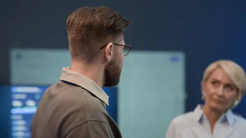 Intercultural Engineers Communicating during Coffee Break in Network Office Stock Footage 334936140