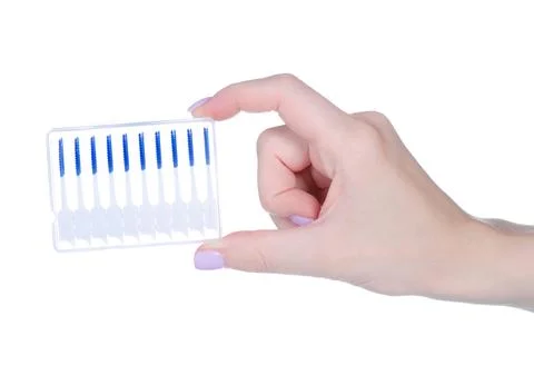 Interdental tooth brushes in hand Stock Photos