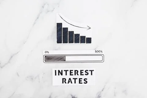 Interest rates going down, text with graph showing stats decreasing and pro.. Stock Photos