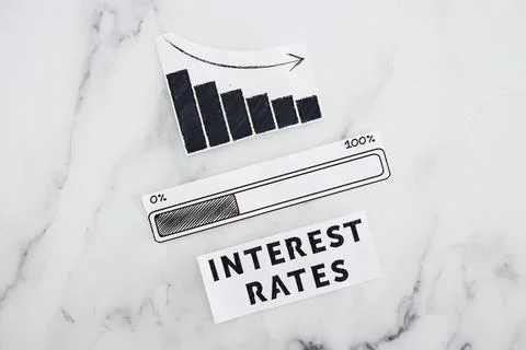 Interest rates going down, text with graph showing stats decreasing and pro.. Stock Photos