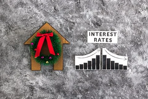 Interest Rates text and graph with stats going up and down next to cardboar.. Stock Photos