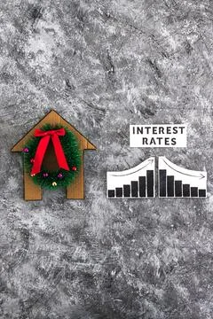 Interest Rates text and graph with stats going up and down next to cardboar.. Stock Photos