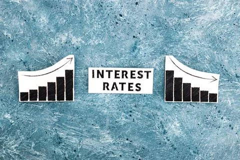 Interest rates text in between graphs with stats going up then going down, ec 写真素材