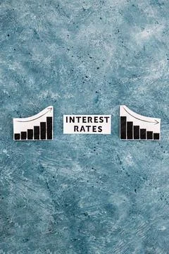 Interest rates text in between graphs with stats going up then going down, ec 写真素材
