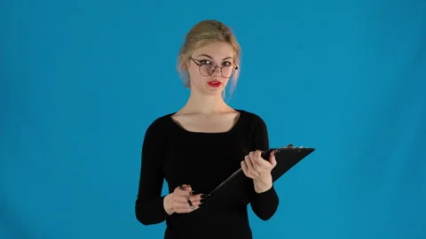 Interested model with pen in hand talking to interlocutor Stock Footage 306474477