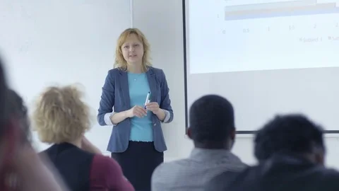 Interested students listening to a lecture in a classroom Stock Footage 69932897