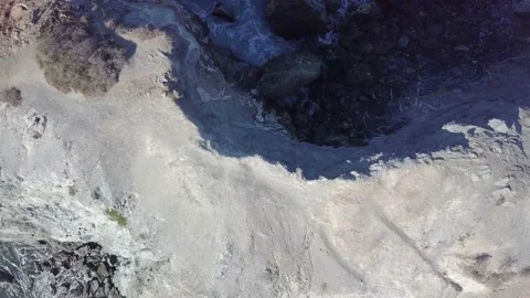 Interesting cliff formations with ocean waves crashing around Video stock 221380318